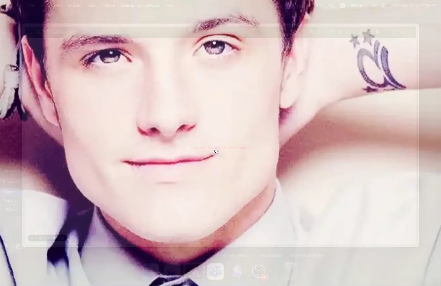 A screenshot of my computer screen, with a large image of Josh Hutcherson overlaid over the entire screen. You can barely make out the desktop behind it.